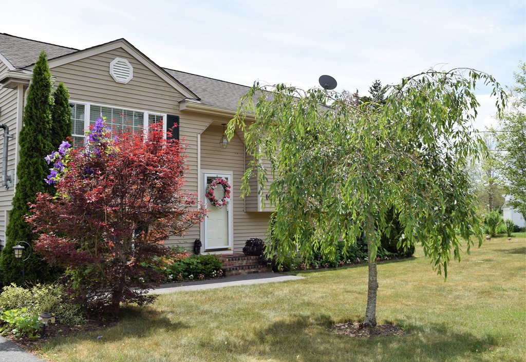 102 Howland Road Freetown, MA 02702 - Photo 1 of 30 a front view of a house with garden