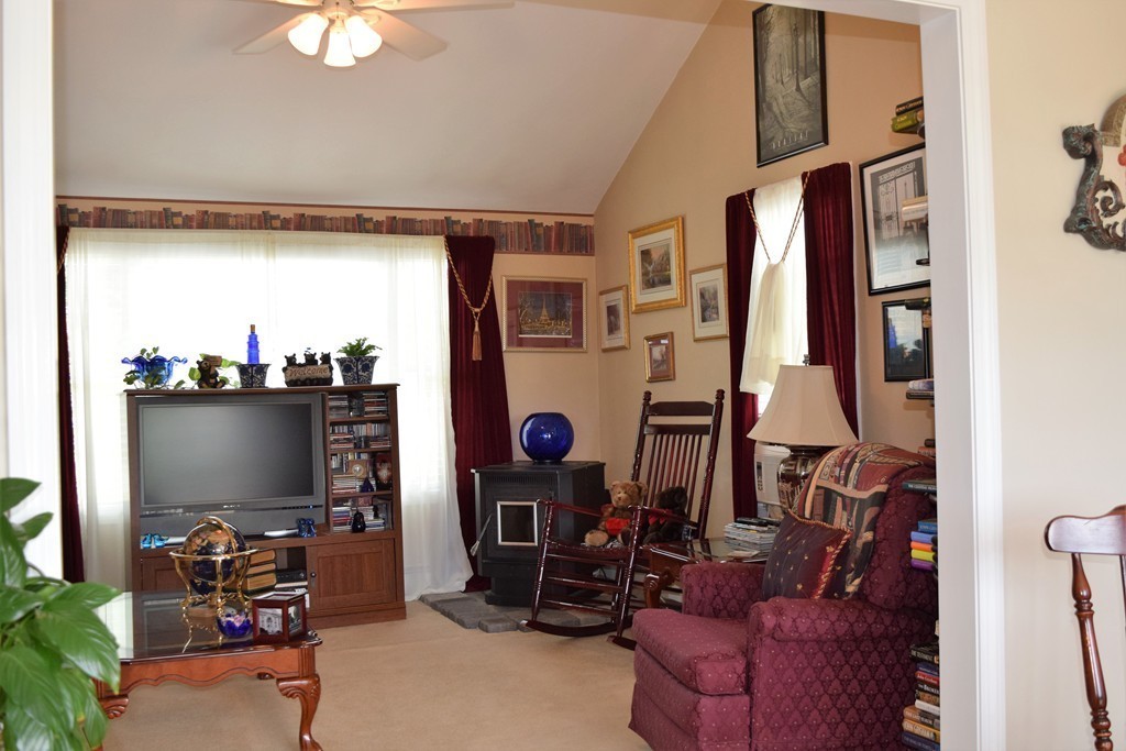 102 Howland Road Freetown, MA 02702 - Photo 11 of 30 a living room with furniture and a flat screen tv