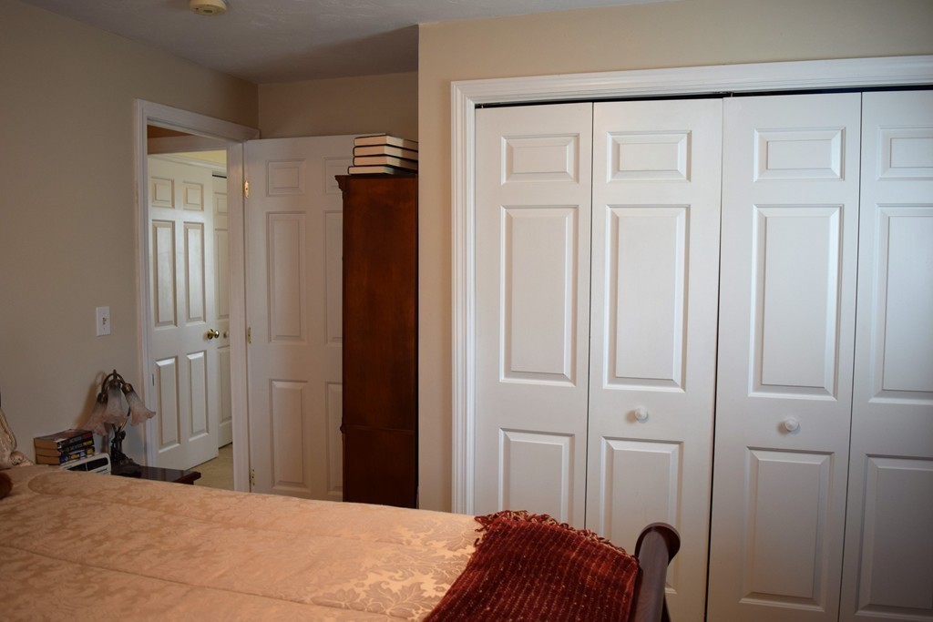 102 Howland Road Freetown, MA 02702 - Photo 17 of 30 a bedroom with a bed and a closet