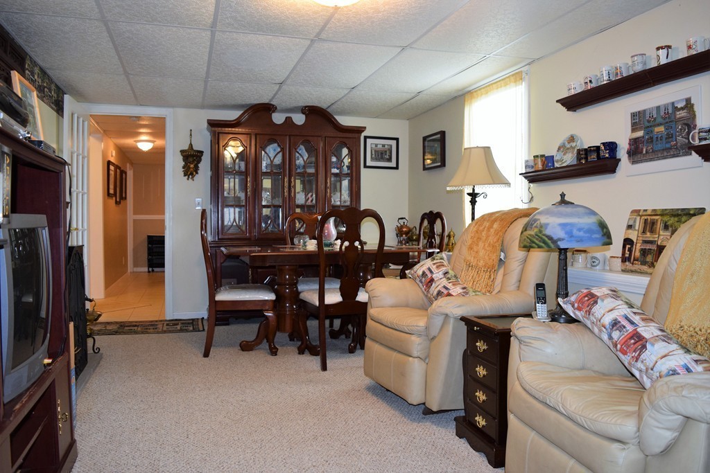 102 Howland Road Freetown, MA 02702 - Photo 19 of 30 a dining room with furniture and chandelier