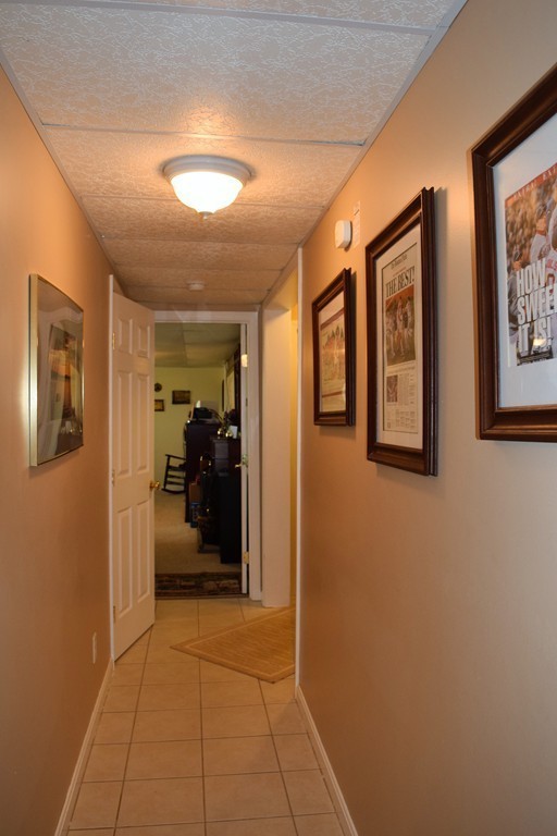 102 Howland Road Freetown, MA 02702 - Photo 20 of 30 a view of a hallway with closet and a couch