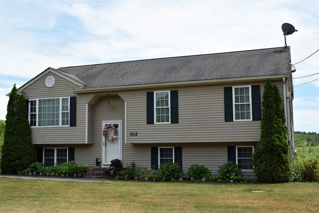 102 Howland Road Freetown, MA 02702 - Photo 2 of 30 a front view of a house with a garden