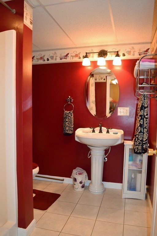 102 Howland Road Freetown, MA 02702 - Photo 21 of 30 a bathroom with a sink and mirror