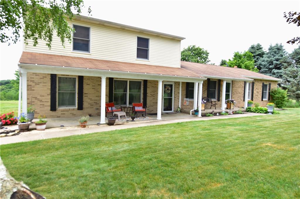 628 Patterson Road Apollo, PA 15613 - Photo 1 of 17 a view of a house with a backyard porch and sitting area