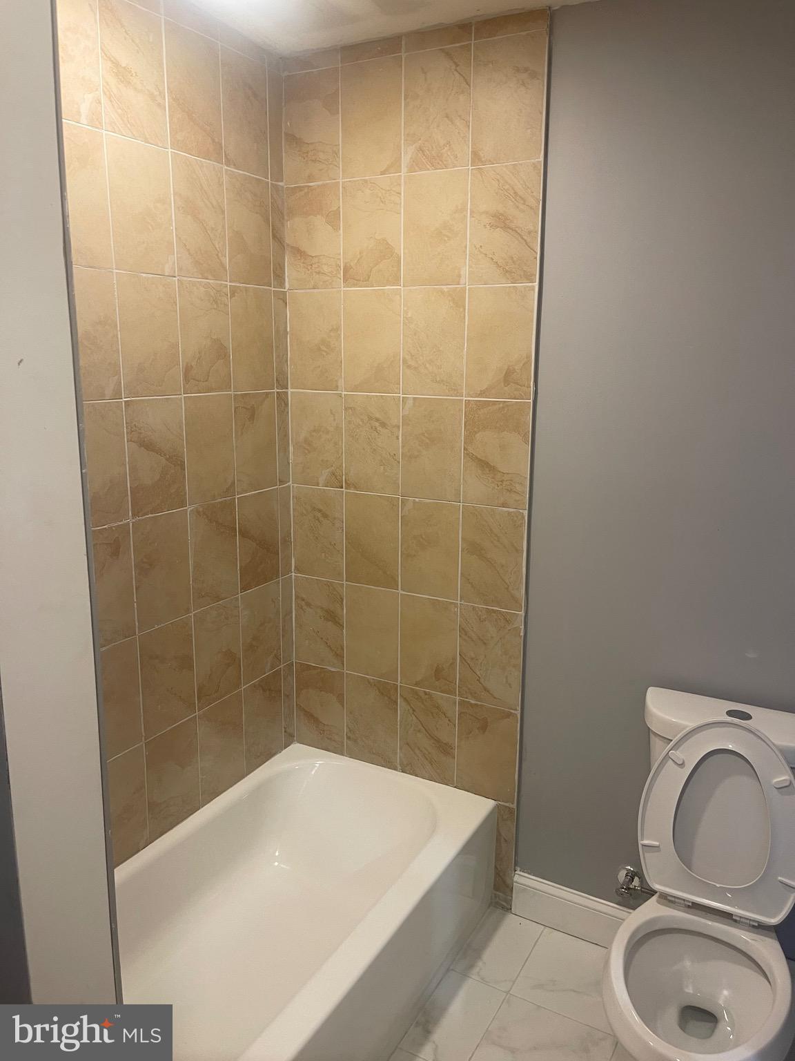 5618 Appletree Street, Unit 2 Philadelphia, PA 19139 - Photo 11 of 11 a bathroom with a sink a toilet and shower