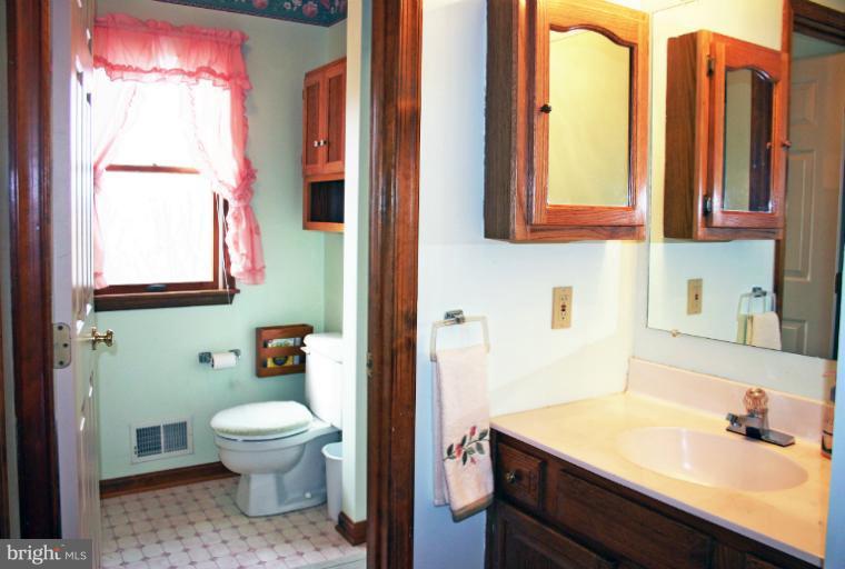 728 Ridge Road Finksburg, MD 21048 - Photo 14 of 25 a bathroom with a sink a toilet and mirror