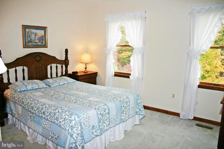728 Ridge Road Finksburg, MD 21048 - Photo 22 of 25 a bedroom with a bed and a window