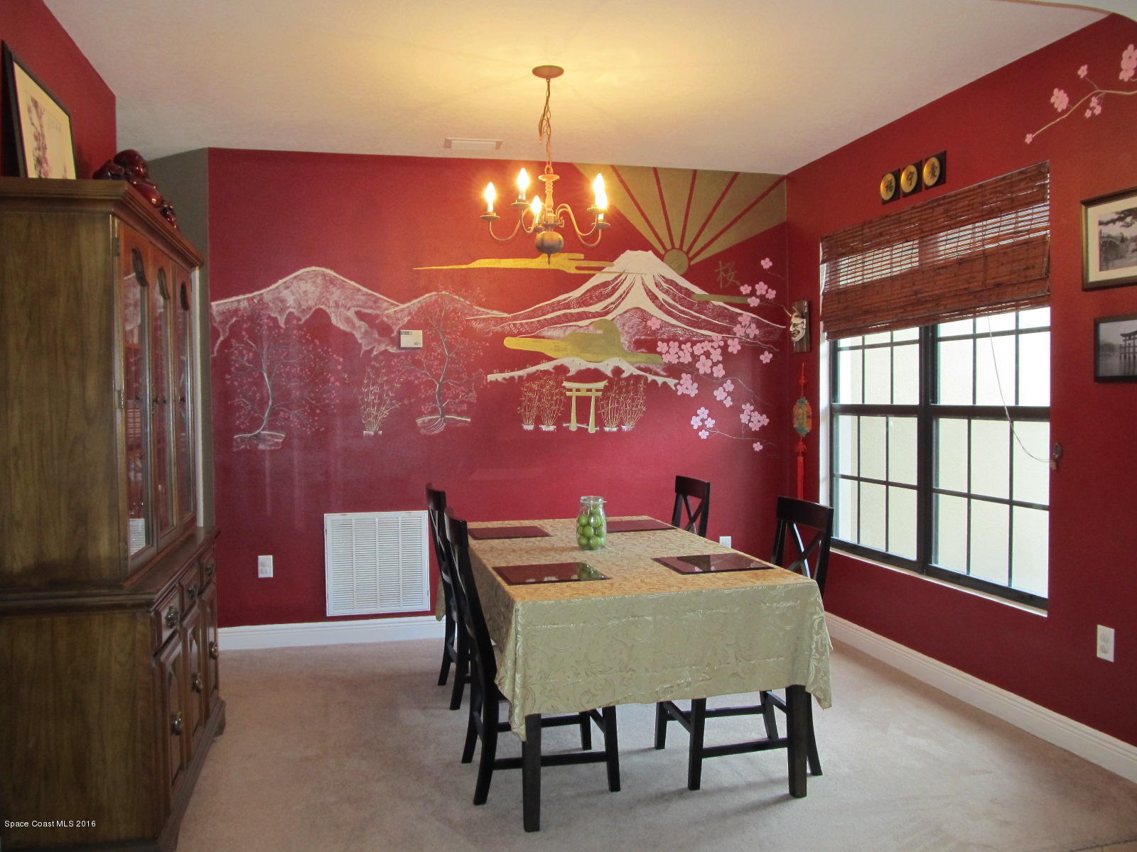 1140 Sexton Road Southwest Palm Bay, FL 32908 - Photo 3 of 20 a view of a dining room with furniture and chandelier fan
