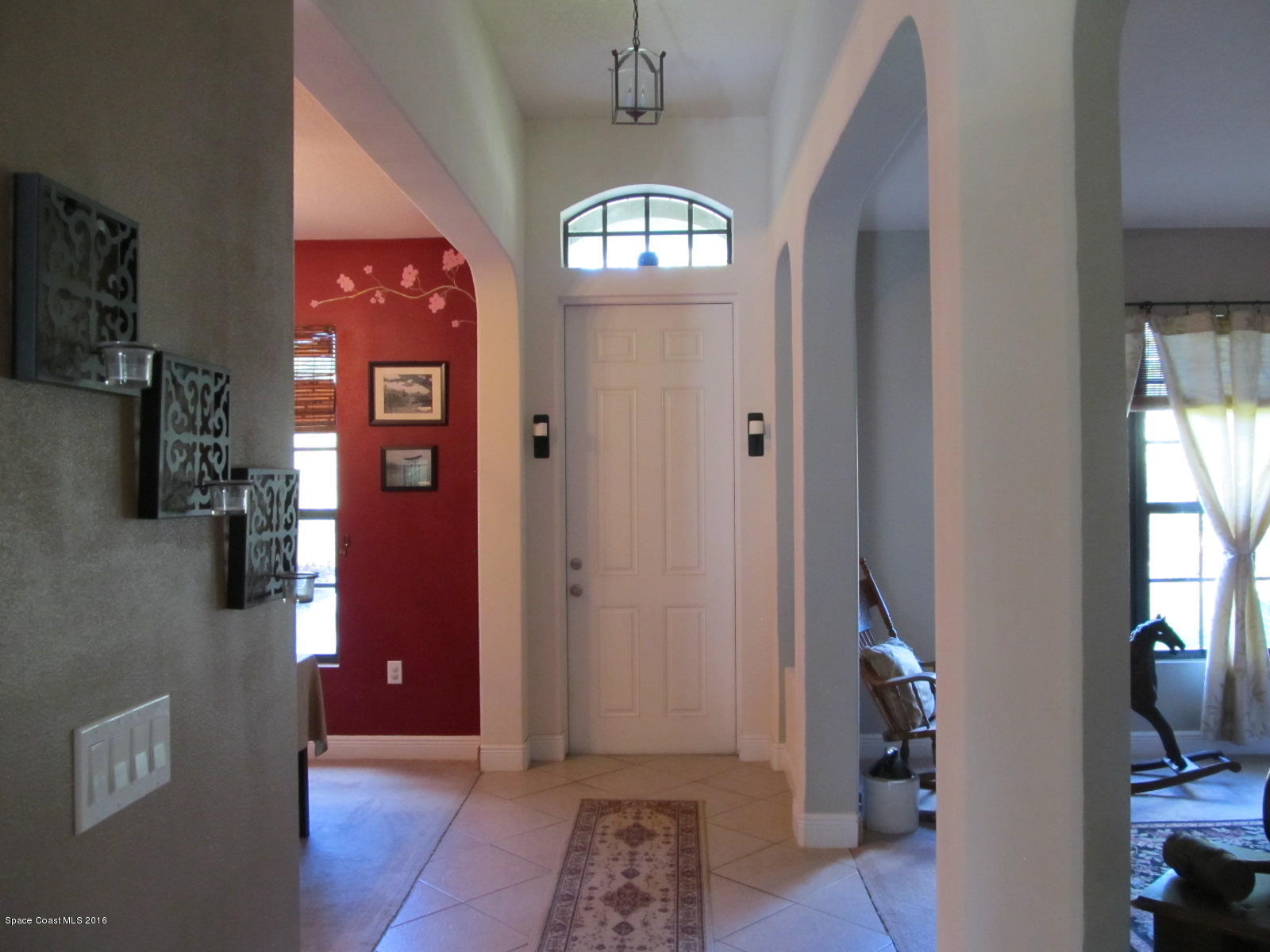 1140 Sexton Road Southwest Palm Bay, FL 32908 - Photo 5 of 20 a view of an entryway with a livingroom