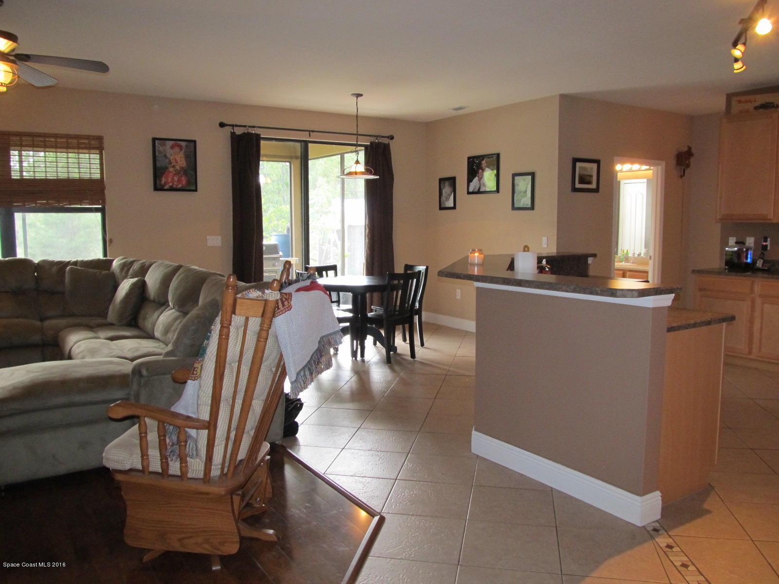 1140 Sexton Road Southwest Palm Bay, FL 32908 - Photo 7 of 20 a living room with furniture and a large window