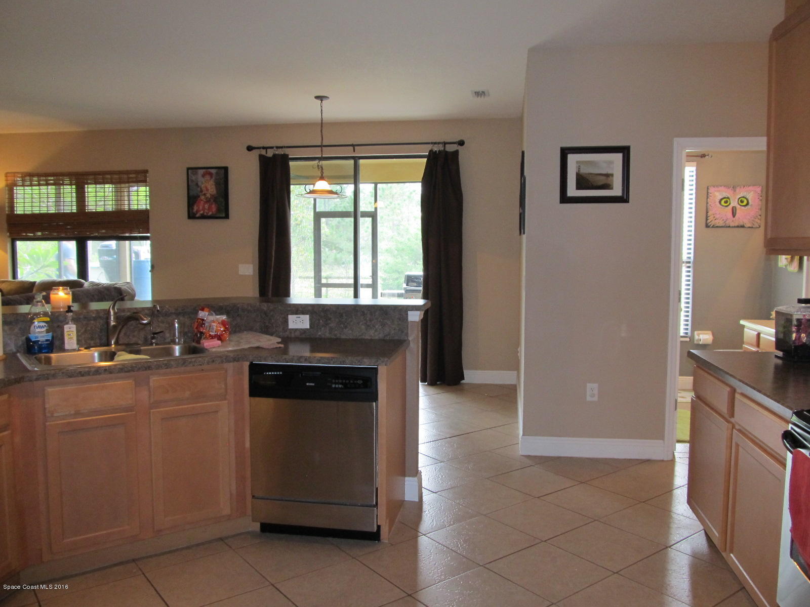 1140 Sexton Road Southwest Palm Bay, FL 32908 - Photo 9 of 20 a kitchen with a stove and a sink
