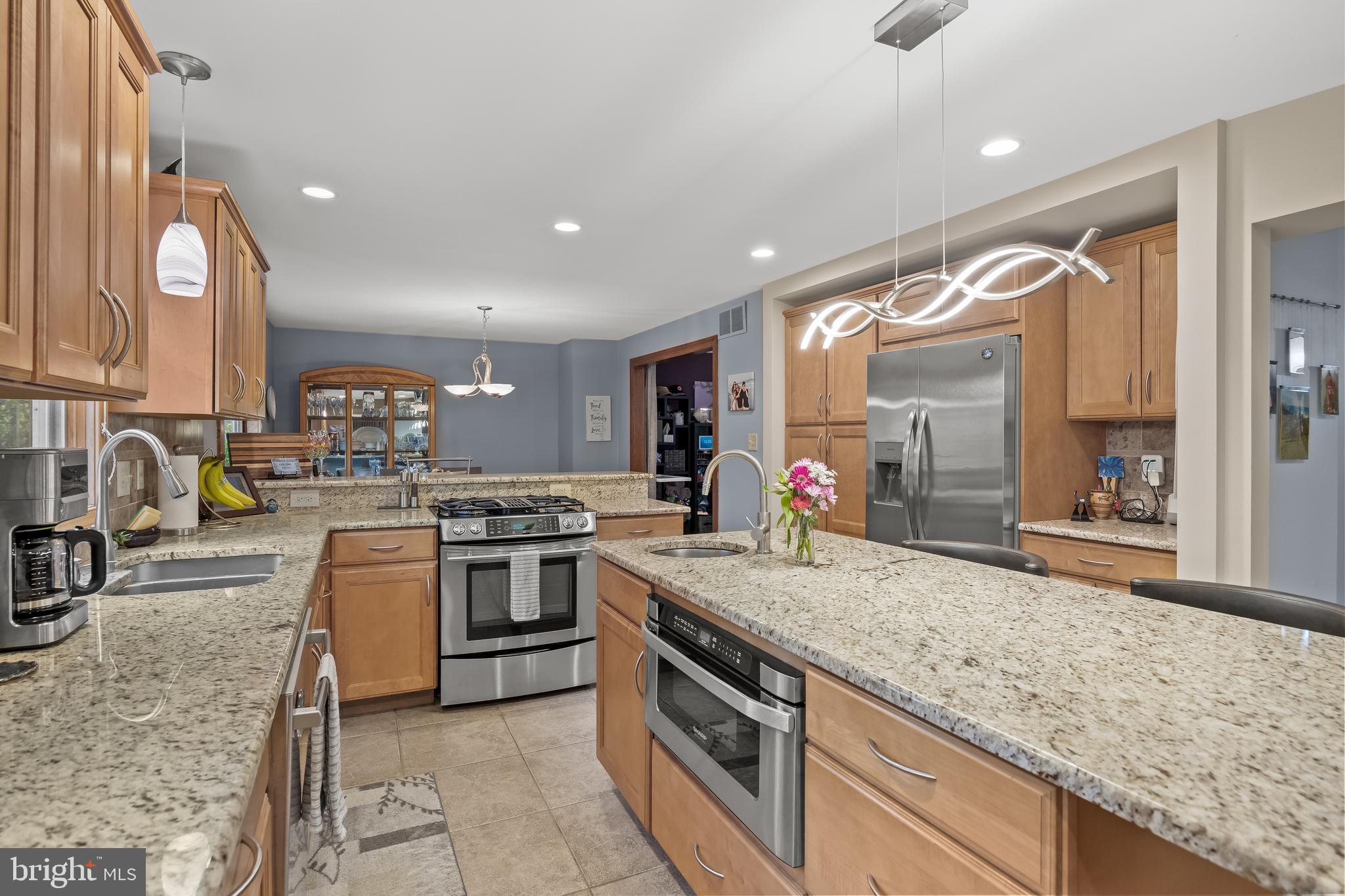 209 Tinder Marlton, NJ 08053 - Photo 11 of 47 a large kitchen with granite countertop a sink and a stove