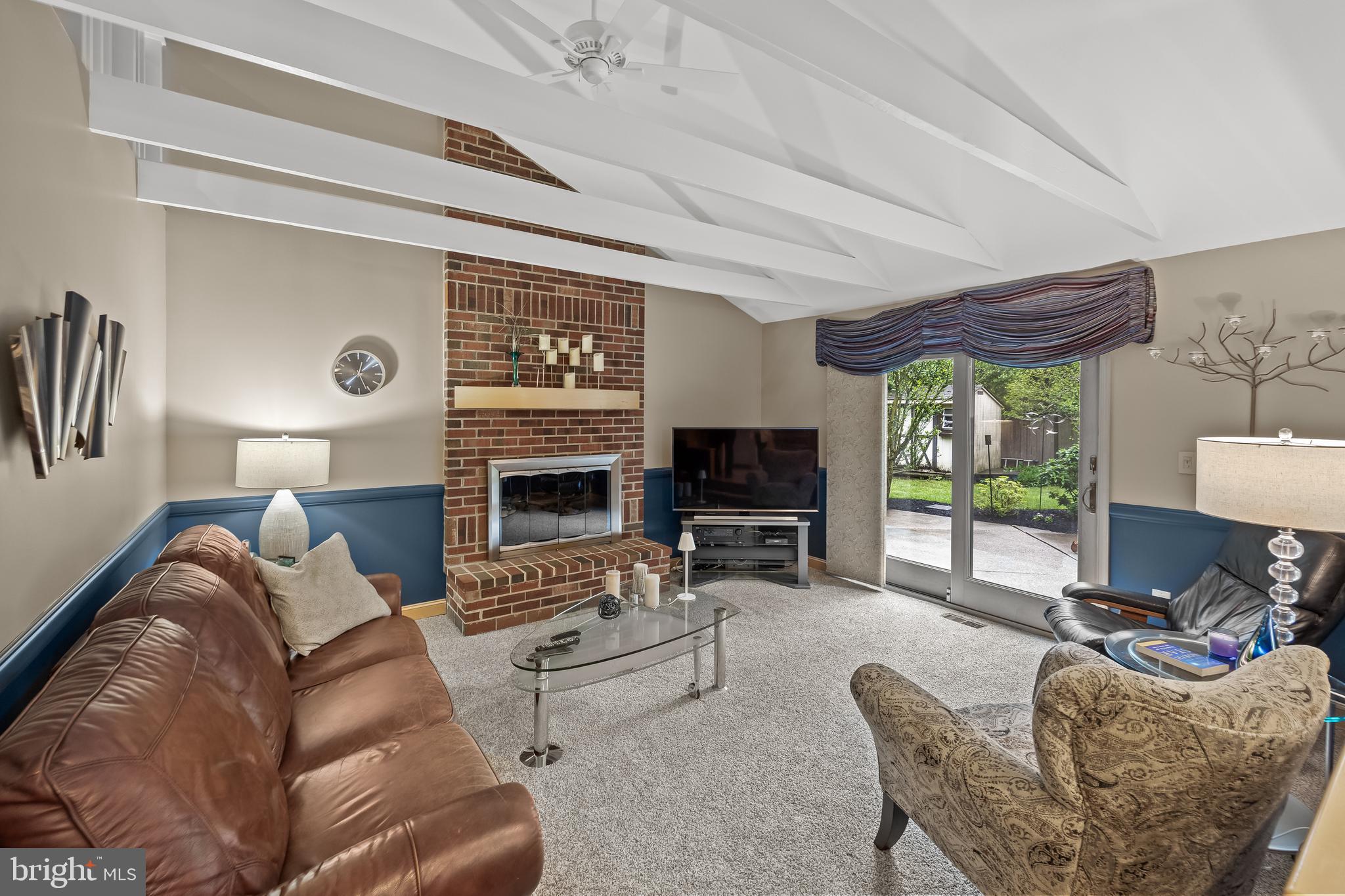 209 Tinder Marlton, NJ 08053 - Photo 15 of 47 a living room with furniture a fireplace and a flat screen tv