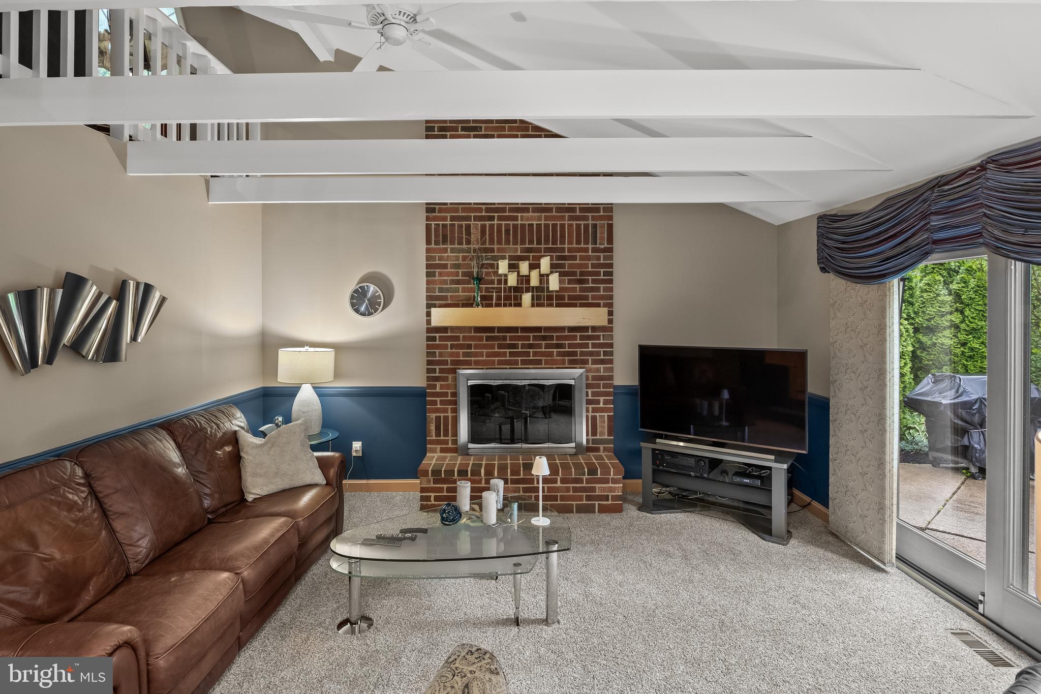 209 Tinder Marlton, NJ 08053 - Photo 16 of 47 a living room with furniture a flat screen tv and a fireplace