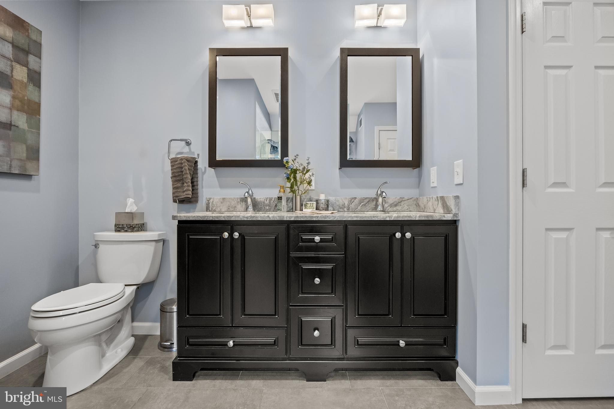 209 Tinder Marlton, NJ 08053 - Photo 27 of 47 a bathroom with a granite countertop toilet sink and mirror
