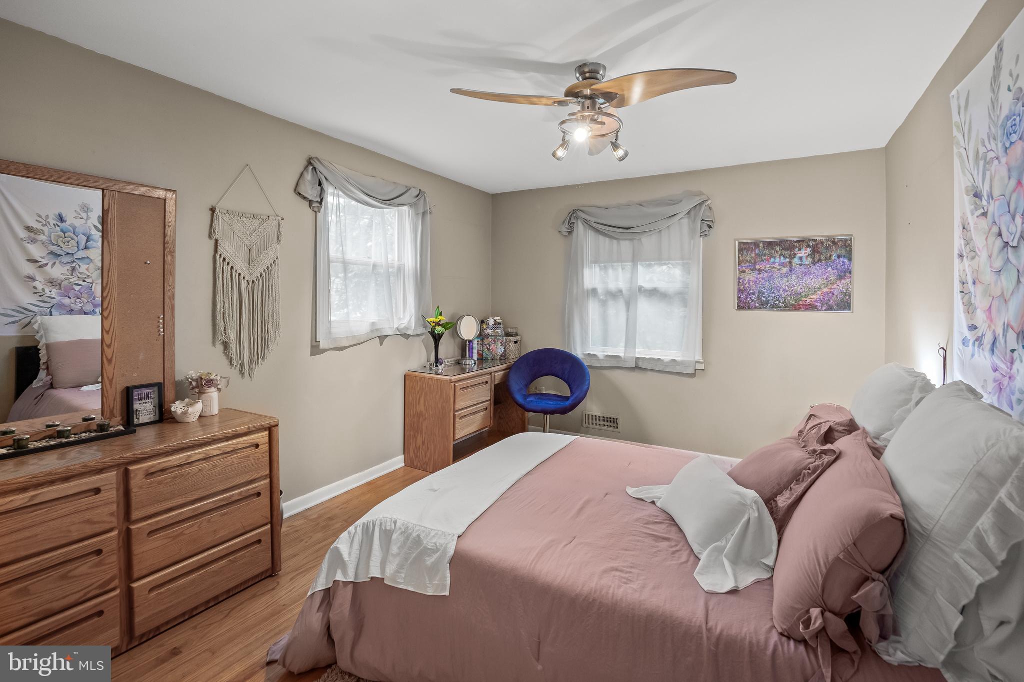 209 Tinder Marlton, NJ 08053 - Photo 31 of 47 a bedroom with a bed and a chandelier