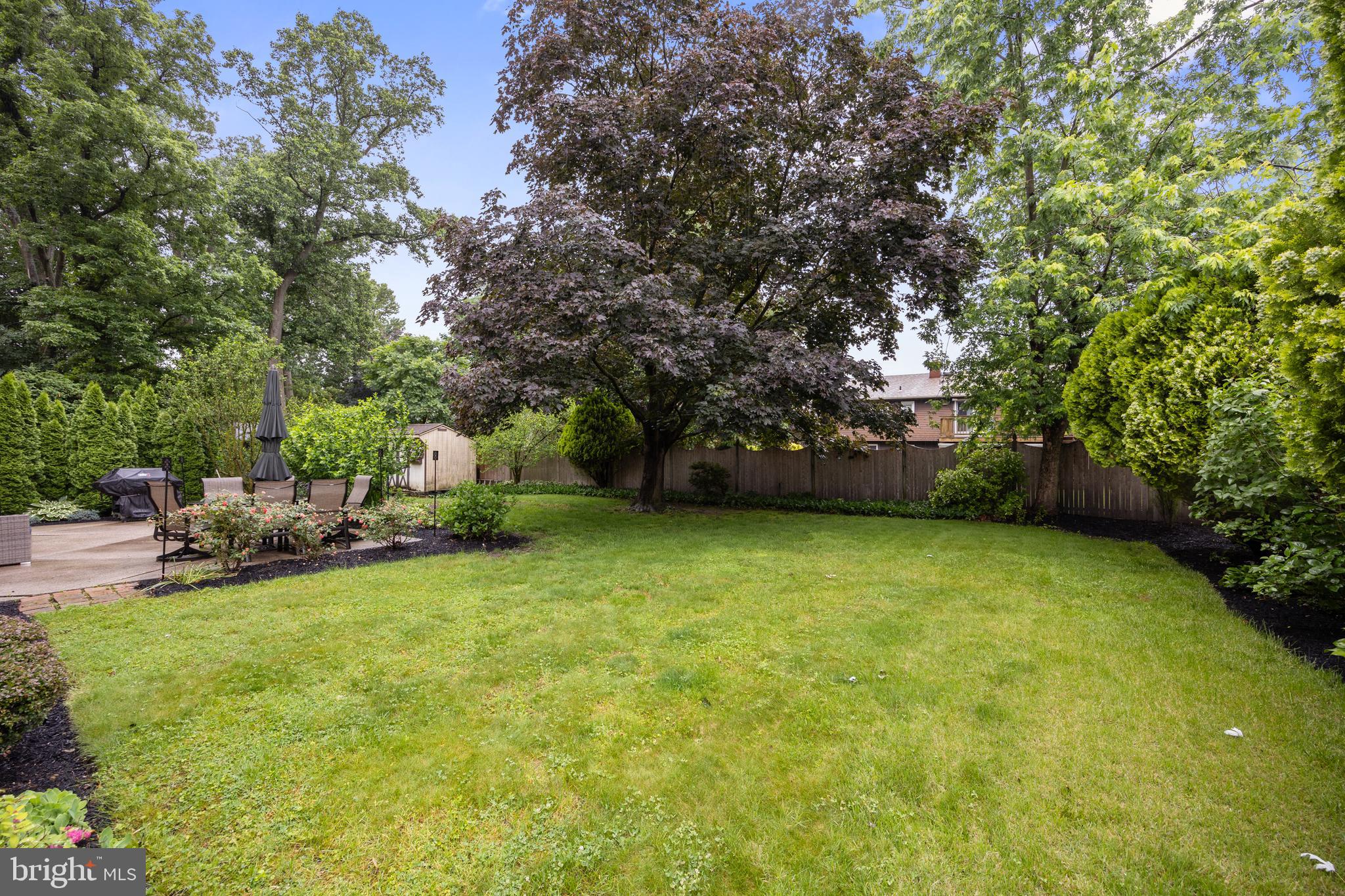 209 Tinder Marlton, NJ 08053 - Photo 38 of 47 a view of a patio with table and chairs and potted plants and large trees