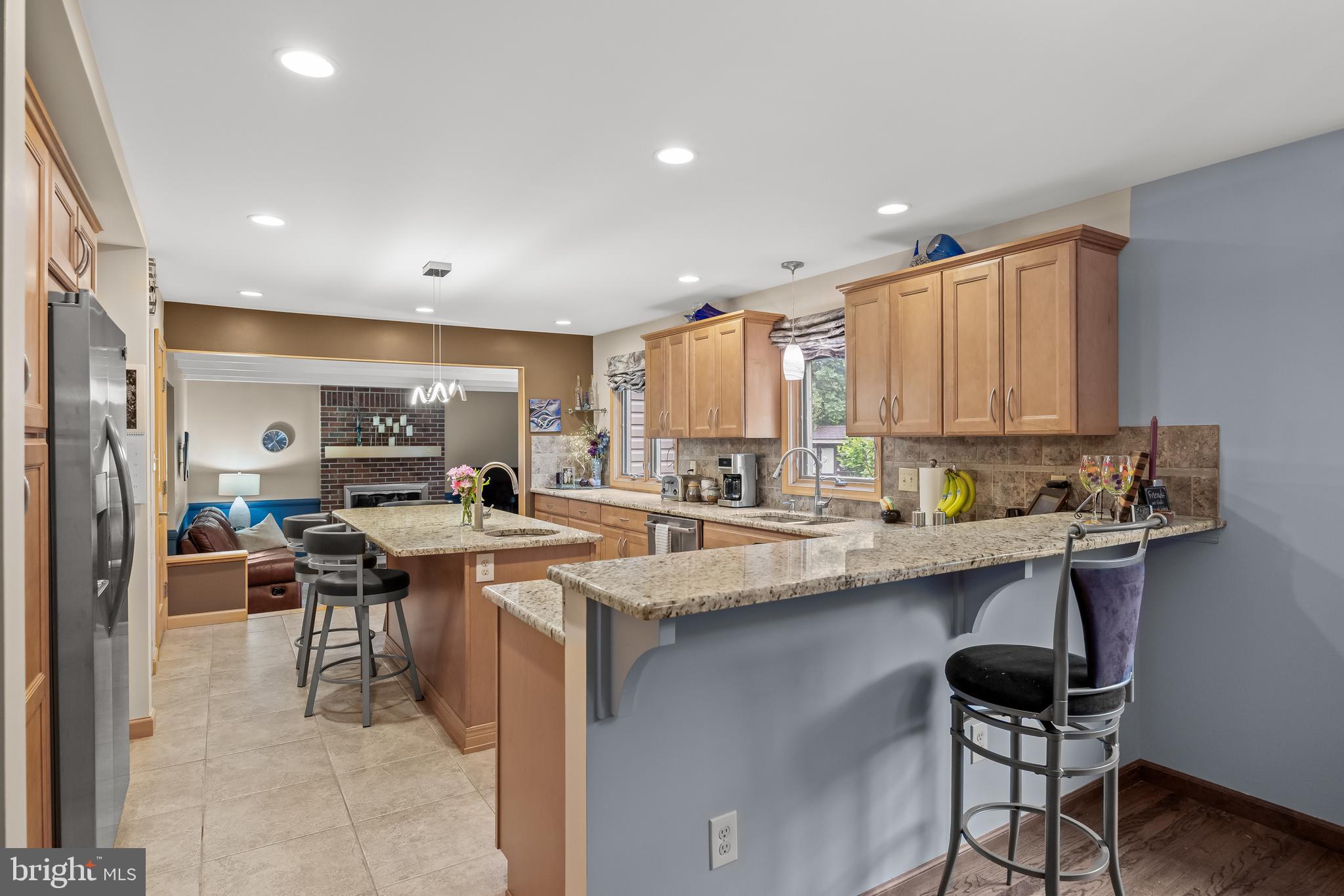 209 Tinder Marlton, NJ 08053 - Photo 9 of 47 a kitchen with stainless steel appliances a sink a stove a refrigerator cabinets and chairs