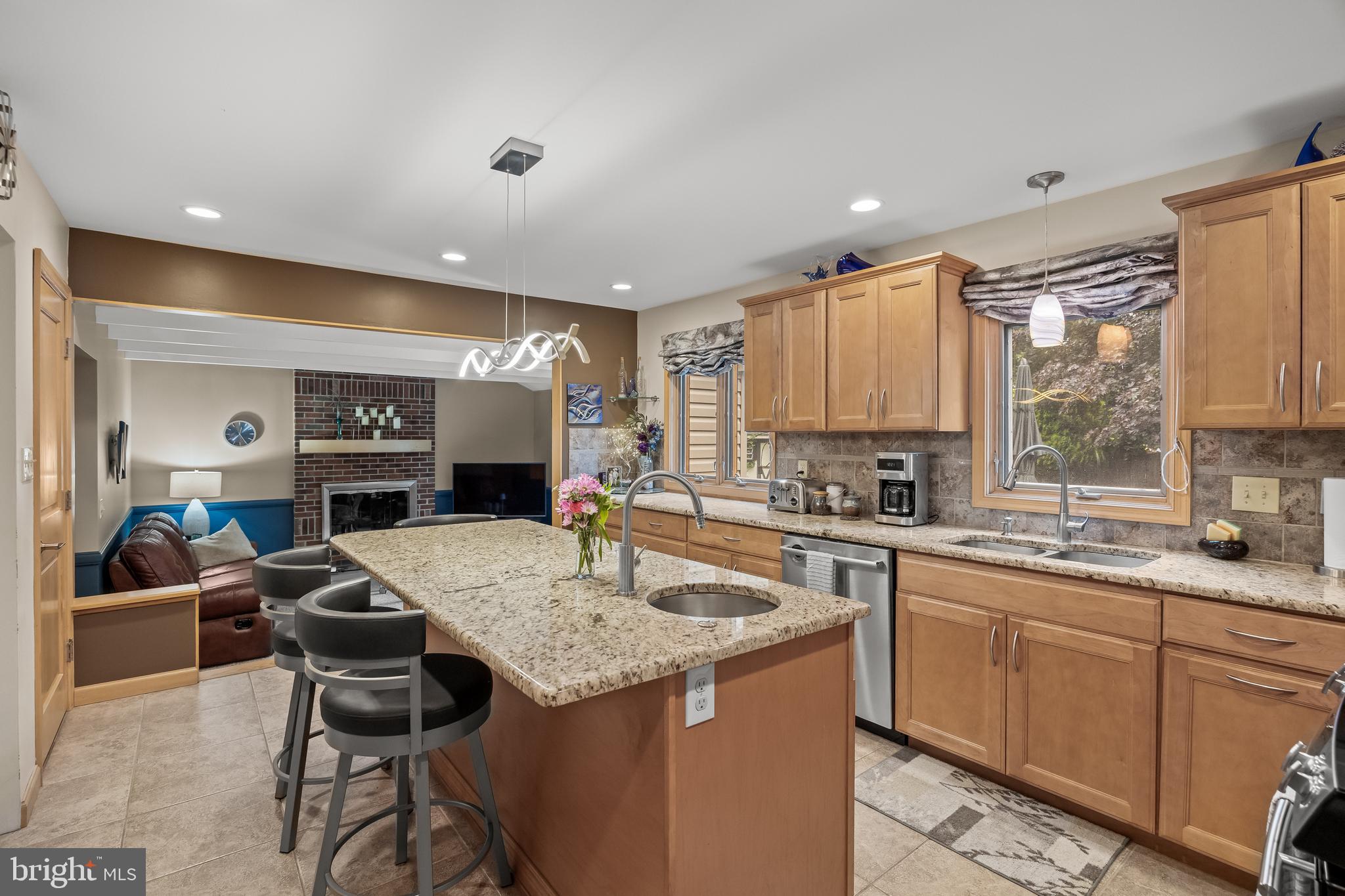 209 Tinder Marlton, NJ 08053 - Photo 10 of 47 a kitchen with a stove a sink a dining table and chairs
