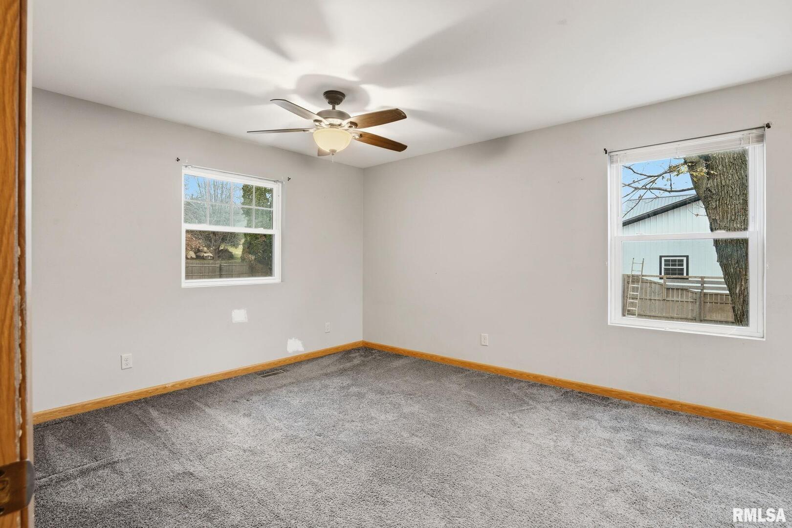 516 4th Street Buffalo, IA 52728 - Photo 11 of 26 a view of an empty room with a window