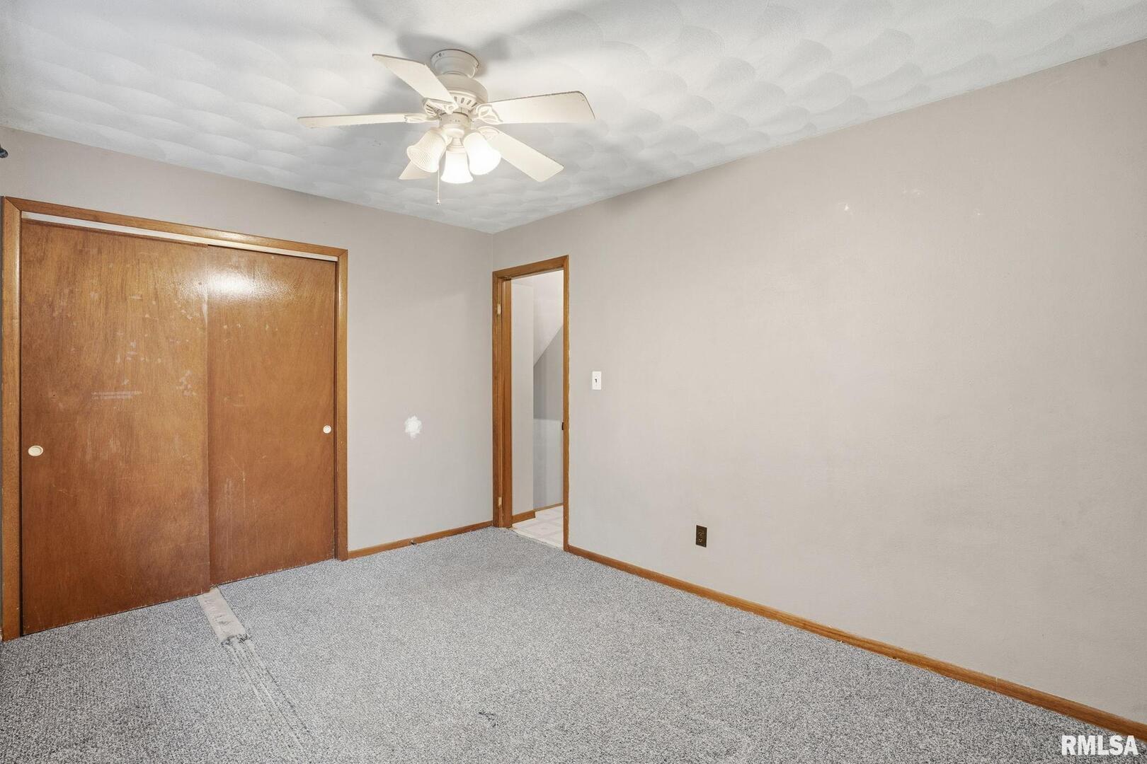 516 4th Street Buffalo, IA 52728 - Photo 14 of 26 a view of a livingroom with a chandelier fan