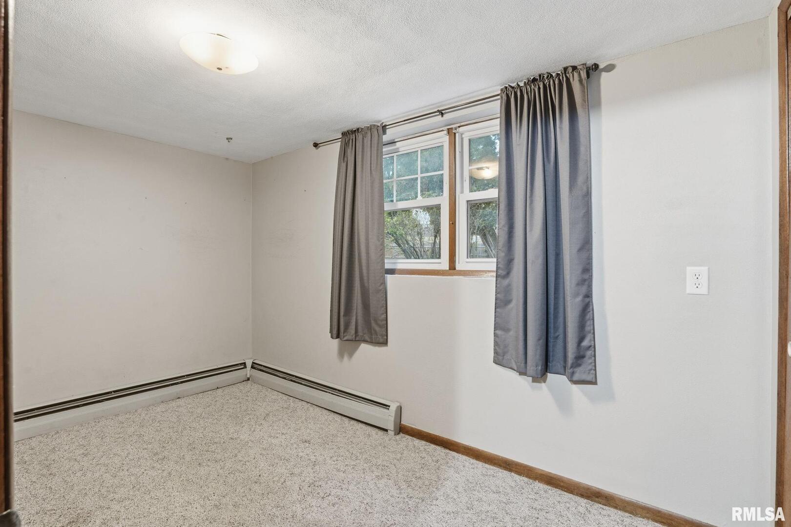 516 4th Street Buffalo, IA 52728 - Photo 16 of 26 a view of an empty room with a window