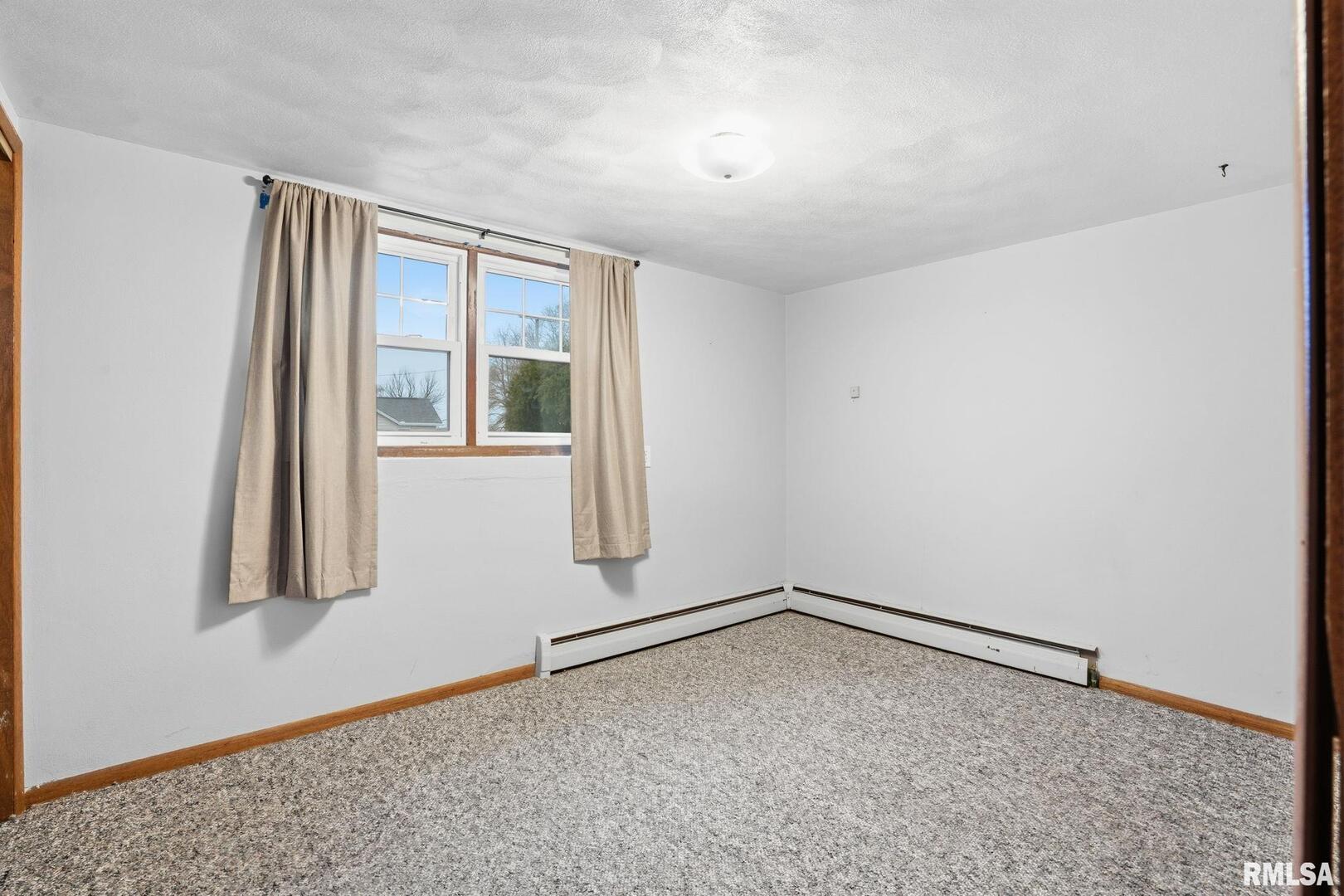 516 4th Street Buffalo, IA 52728 - Photo 19 of 26 wooden floor in an empty room
