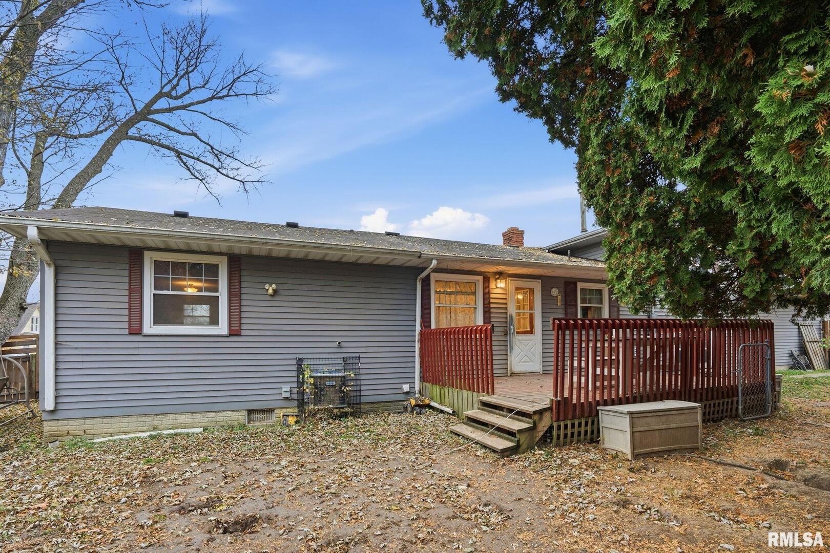 516 4th Street Buffalo, IA 52728 - Photo 25 of 26 a view of a house with a yard and wooden fence