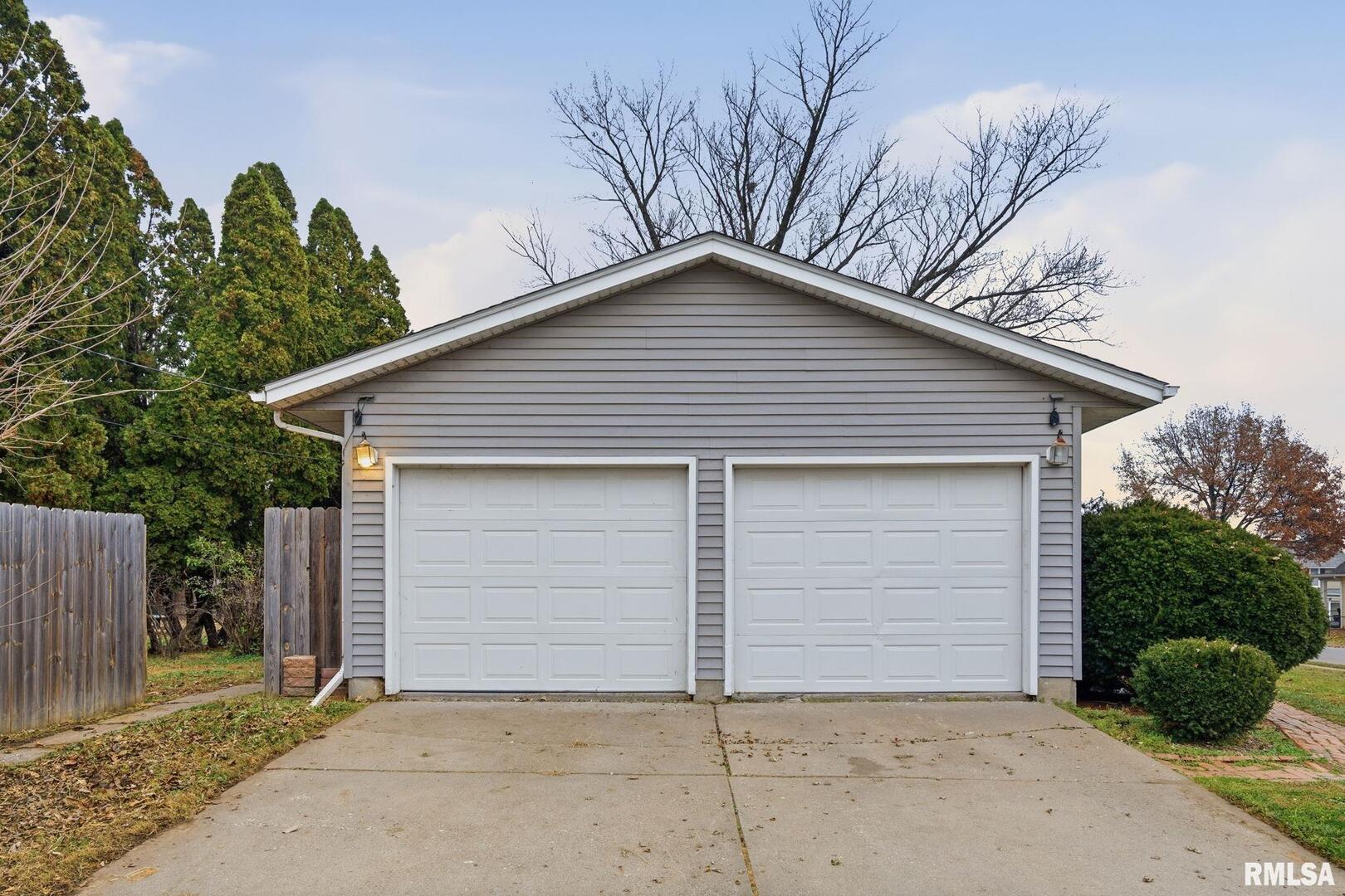 516 4th Street Buffalo, IA 52728 - Photo 26 of 26 a house with a garage