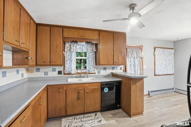 a kitchen with a sink and a window