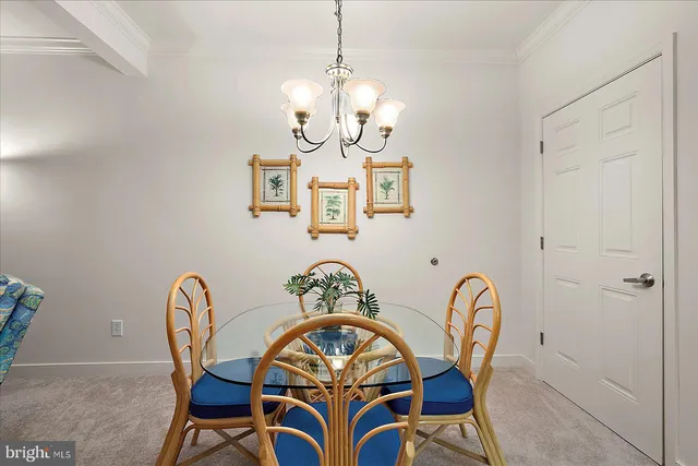 a view of a dining room that has a table and chairs