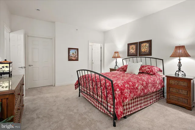 a bed room with a bed and a lamp