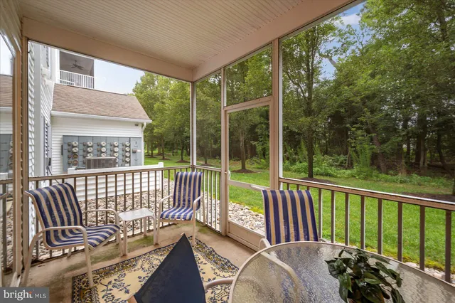a view of balcony with furniture
