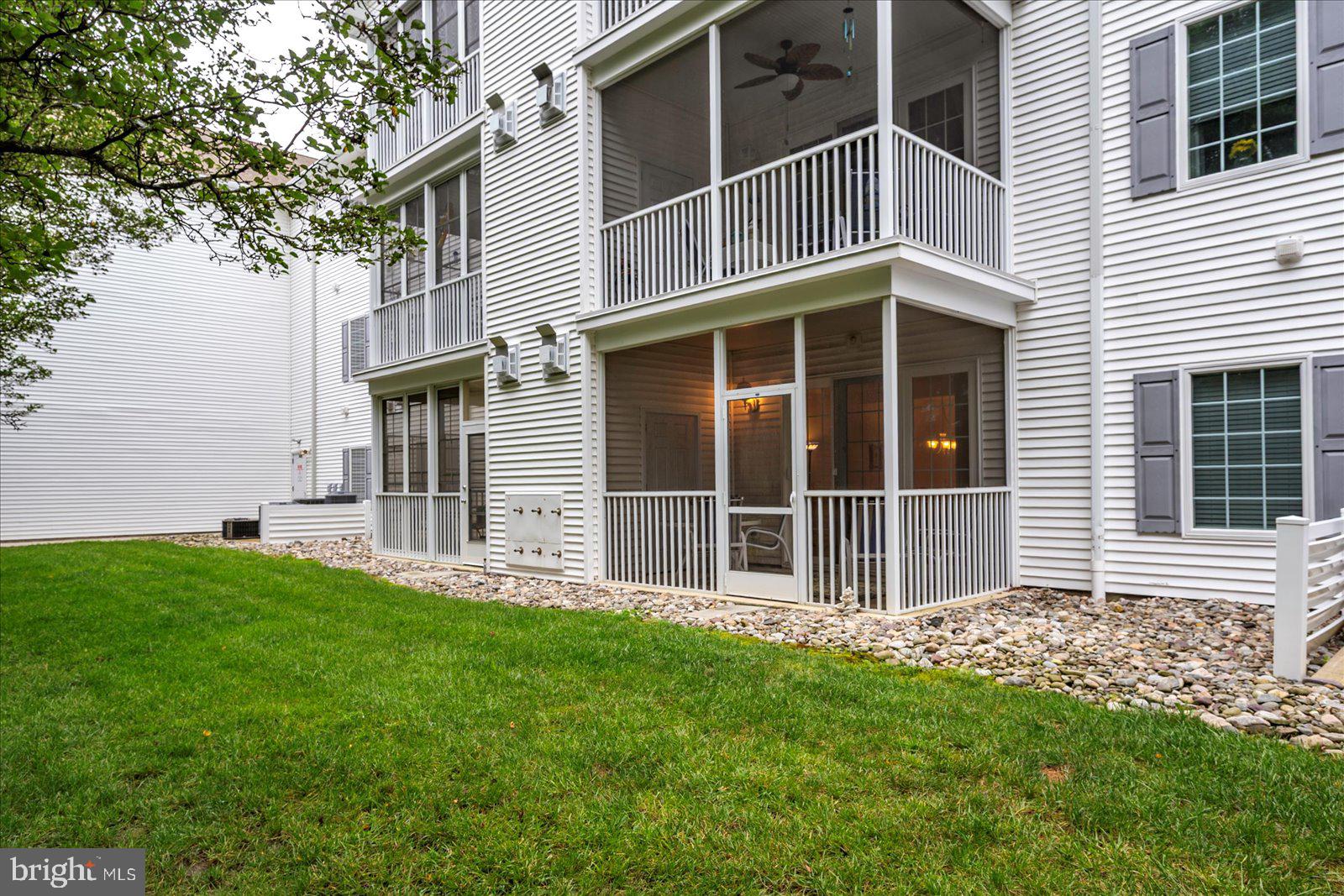 30611 Cedar Neck Road, Unit 2107 Ocean View, DE 19970 - Photo 31 of 44 a view of a house with a yard