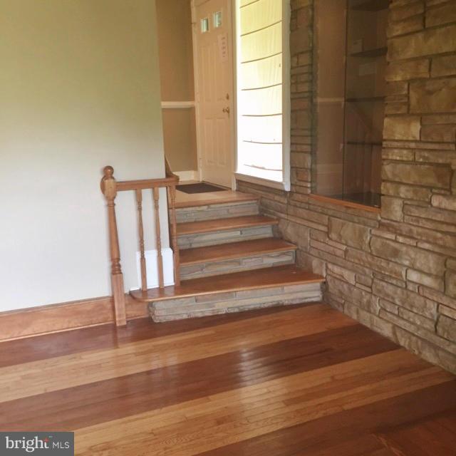 9403 Brandywine Road Clinton, MD 20735 - Photo 3 of 30 HWD Steps Leads From Foyer to Living Room
