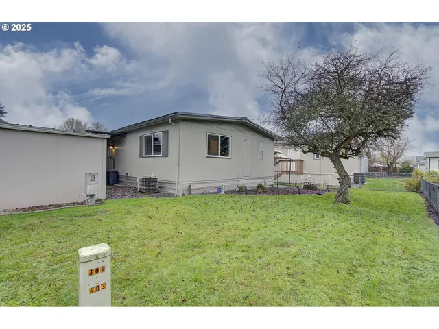 a house view with a sitting space and garden