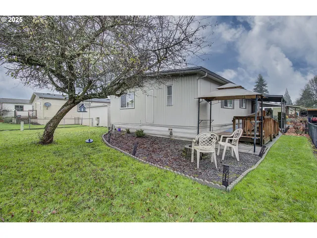 a view of a porch with wooden floor and fence