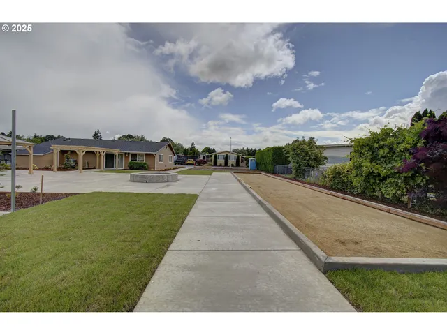 a view of a park with large trees