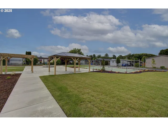 a view of house with outdoor space and sitting area