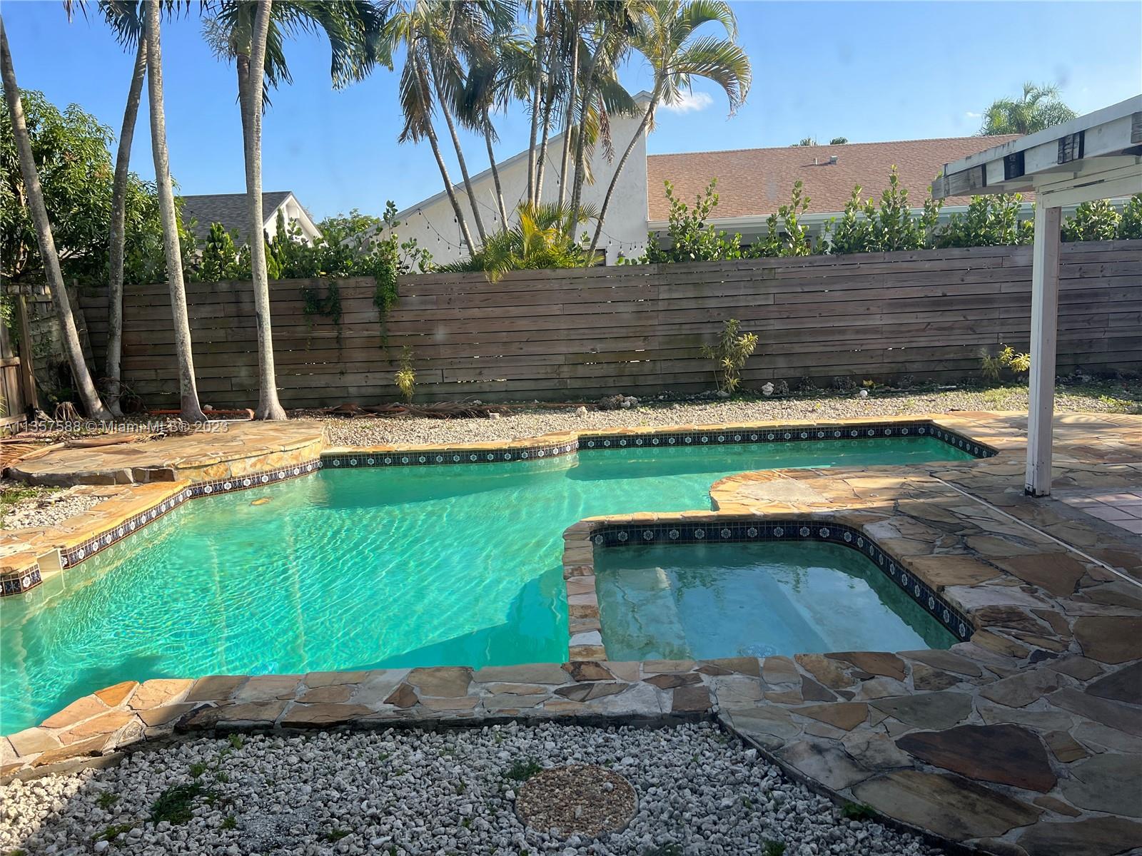a view of swimming pool with a yard