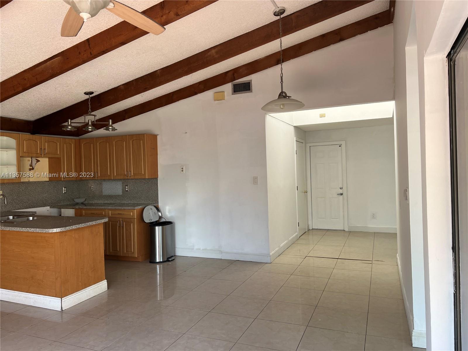 The Hammocks Miami, FL 33186 - Photo 13 of 28 a kitchen with stainless steel appliances granite countertop a sink and a refrigerator