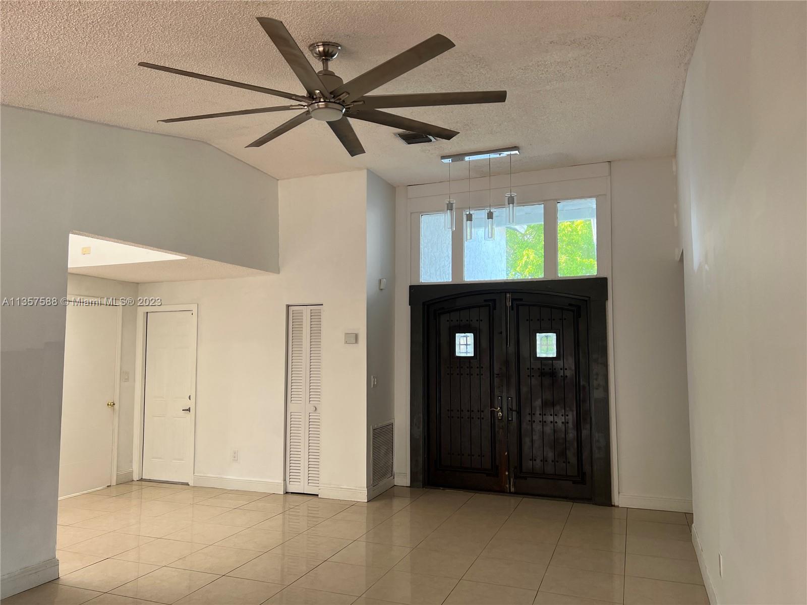 The Hammocks Miami, FL 33186 - Photo 6 of 28 a view of empty room with window and ceiling fan