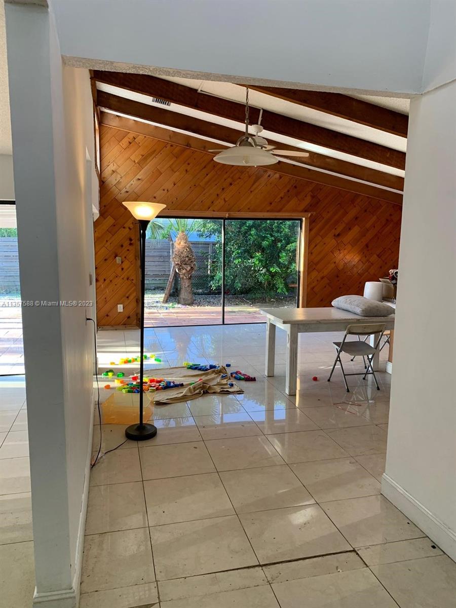 The Hammocks Miami, FL 33186 - Photo 10 of 28 a room with gym equipment and a table