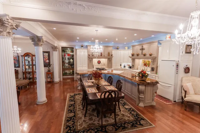 a large kitchen with a table and chairs in it