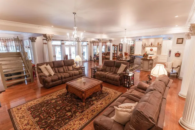 a living room with lots of furniture and a rug
