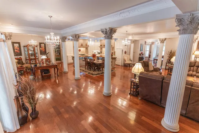 a view of a room with lots of wooden furniture