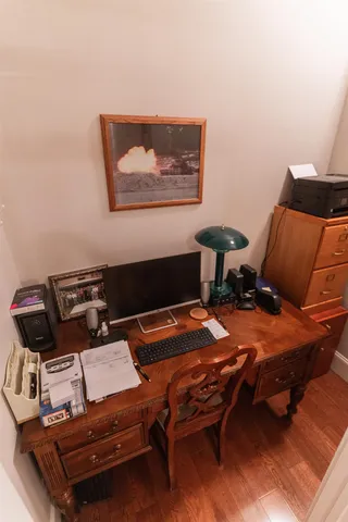 a reading room with furniture and wooden floor