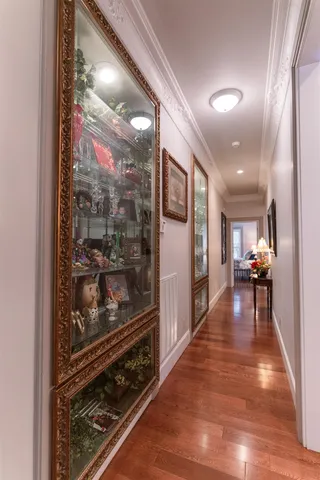 a view of a hallway view with living room filled with furniture