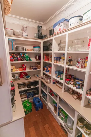 a spacious bedroom with a bed and a fireplace