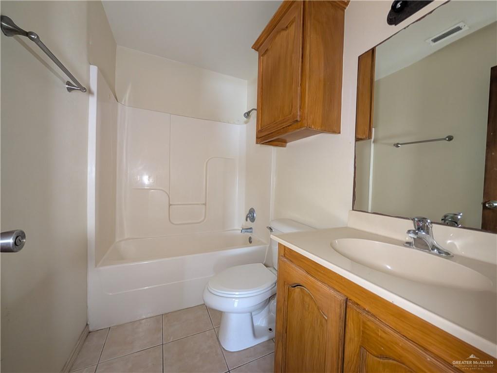 912 French Avenue, Unit 1 Edinburg, TX 78541 - Photo 6 of 7 a bathroom with a sink a toilet and shower